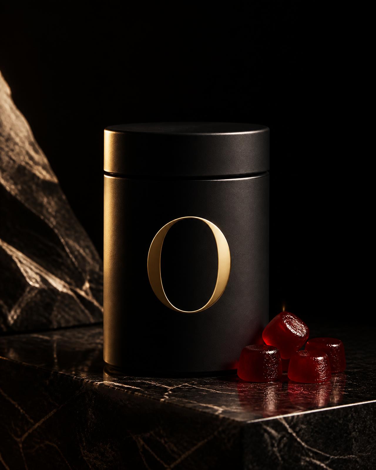 OPTIMAL matte black jar with gold O emblem beside deep red daily performance gummies on dark stone